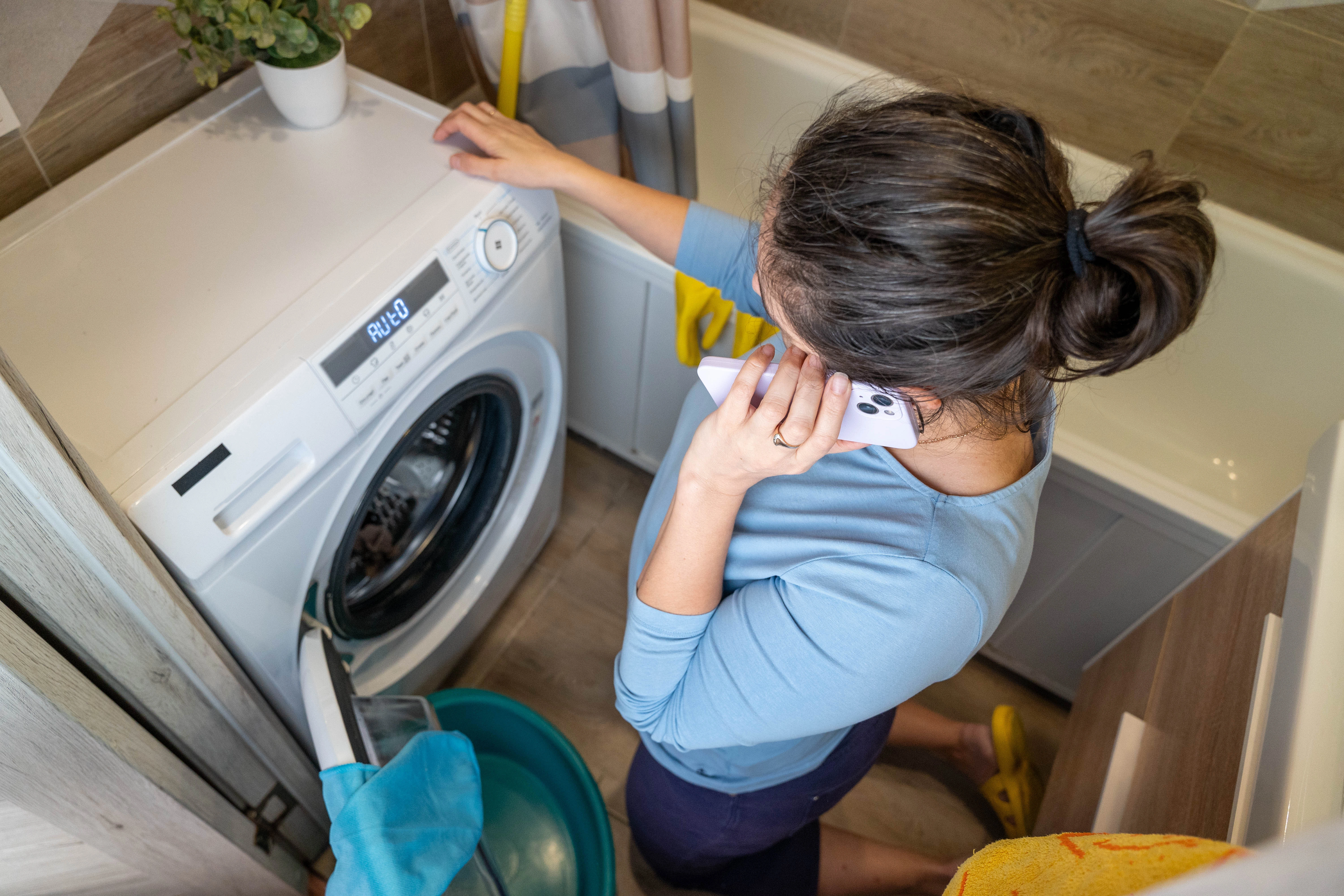 Technician diagnosing a home appliance